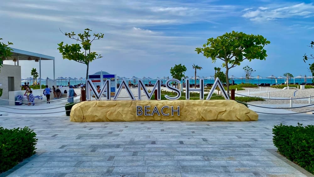 The Mamsha Beach entrance sign, the walkable heart of Saadiyat’s dining and beach scene